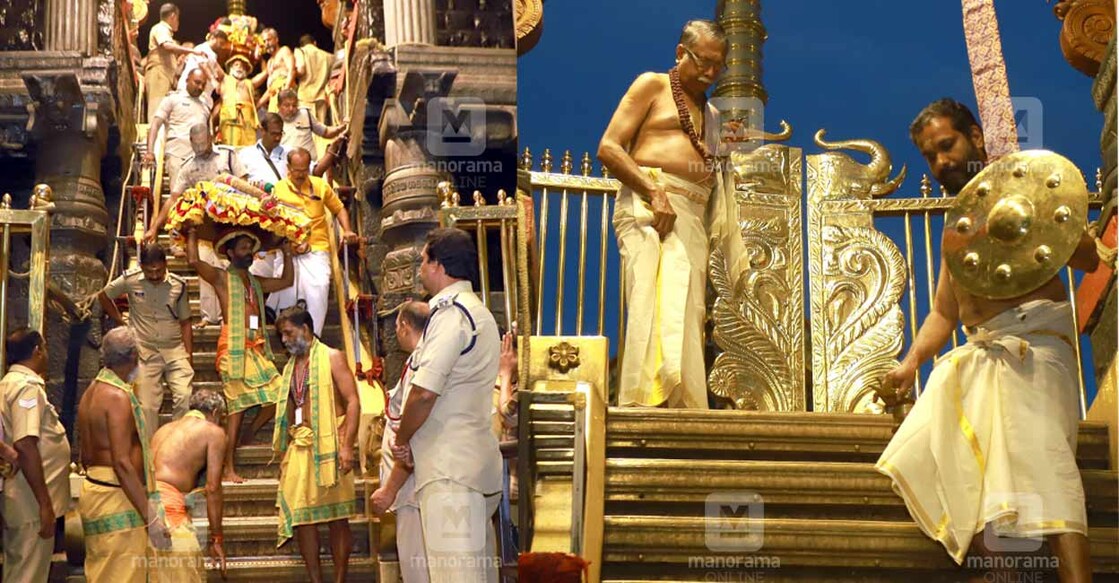 sabarimala തിരുവാഭരണ വാഹകസംഘം തിരുവാഭരണ പേടകങ്ങളുമായി അയ്യനെ വണങ്ങി അനുവാദം വാങ്ങി പതിനെട്ടാംപടി ഇറങ്ങുന്നു. ചിത്രം. മനോരമ