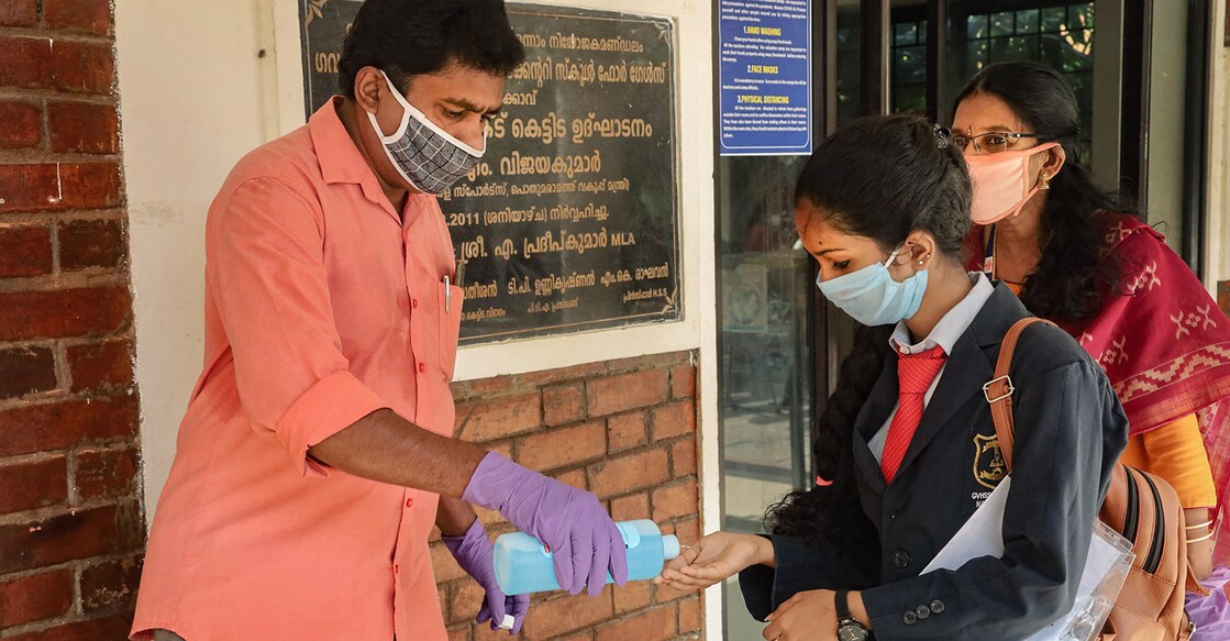 Kozhikode: A student sanitizes her hands before entering the examination hall to attend VHSE exam at a school, during the ongoing COVID-19 lockdown, in Kozhikode, Tuesday, May 26, 2020. (PTI Photo)(PTI26-05-2020_000036A)