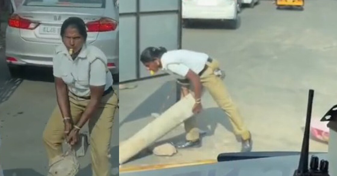 ആംബുലൻസിനു വഴിയൊരുക്കാൻ കോൺക്രീറ്റ് തൂണുകൾ എടുത്തു മാറ്റുന്ന ട്രാഫിക് വാർഡൻ. (Photo credit: video grab)