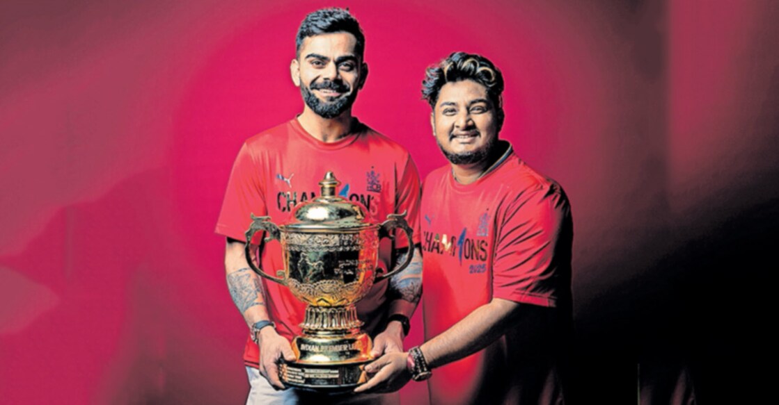 വിരാട് കോലിക്കൊപ്പം ഐപിഎൽ ട്രോഫിയുമായി ഗബ്രിയേൽ ബെൻ കുര്യൻ.