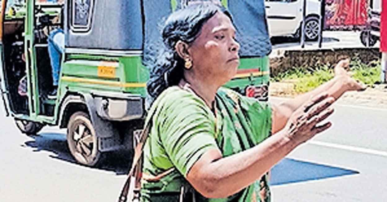 Hunger-Stricken Mother of Slain Law Student Takes to Controlling Traffic in Aluva