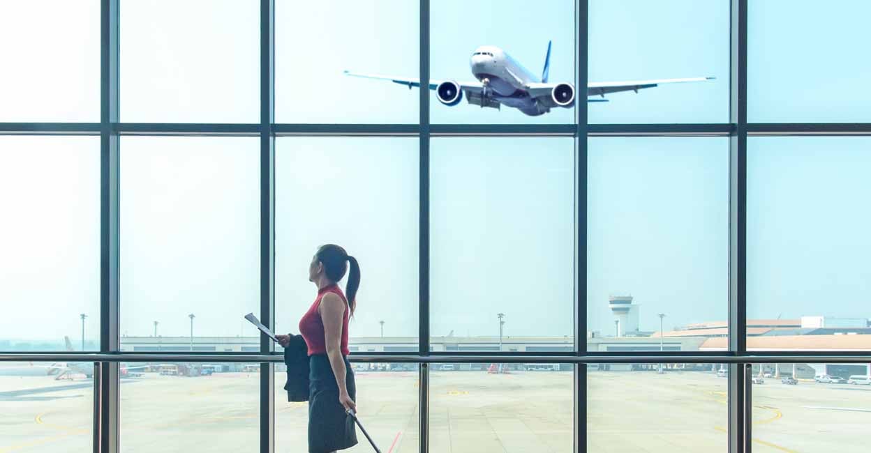 travel-1248 Traveler Business asian women travel with leave luggage for meet at the airport fly to see work in foreign countries. People holding passport wait airplane airport for destination leisure