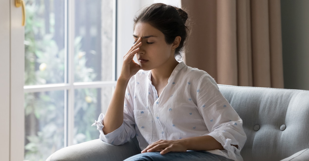 Depressed frustrated young Indian woman Photo By: fizkes/Shutterstock.