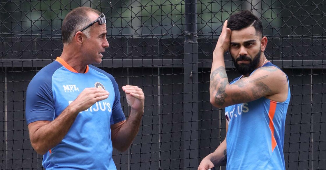 CRICKET-WC-2022-T20-IND-TRAINING India's mental conditioning coach Paddy Upton (L) talks to player Virat Kohli during a practice session at the Adelaide Oval in Adelaide on November 9, 2022, on the eve of their ICC men's Twenty20 World Cup 2022 cricket semi-final match against England. (Photo by Surjeet Yadav / AFP) / -- IMAGE RESTRICTED TO EDITORIAL USE - STRICTLY NO COMMERCIAL USE -- - -- IMAGE RESTRICTED TO EDITORIAL USE - STRICTLY NO COMMERCIAL USE --