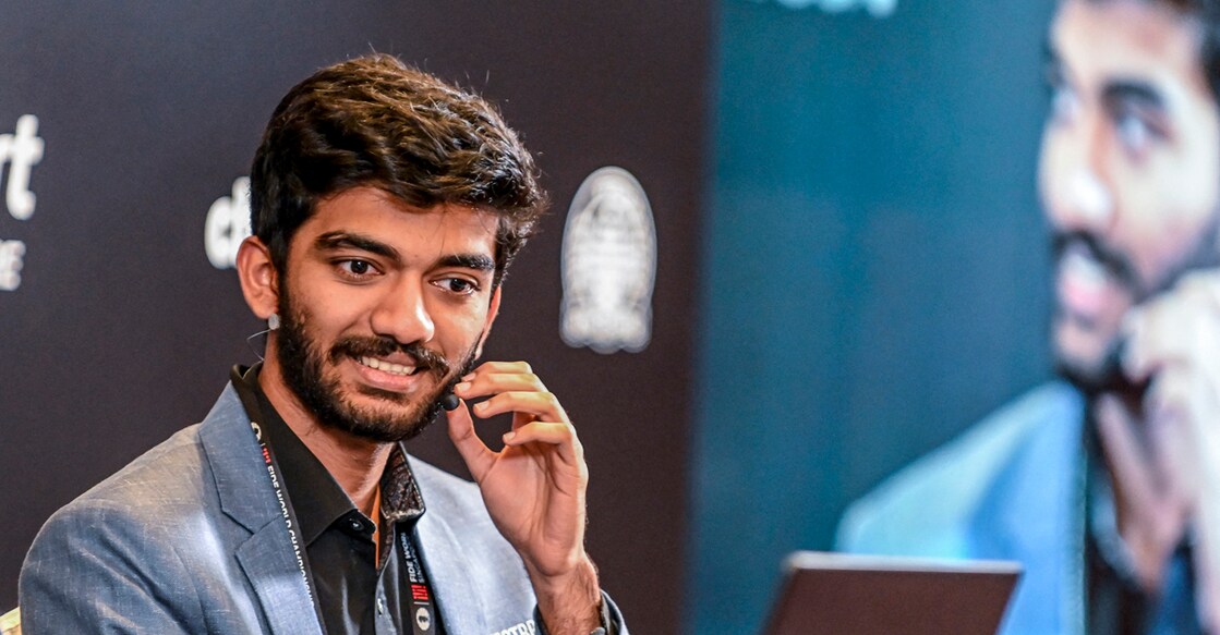 CHESS-2024-CHN-IND-SIN India's grandmaster Gukesh Dommaraju speaks during a press conference after winning against China's chess grandmaster Ding Liren in game 14 of the 2024 FIDE World Championship in Singapore on December 12, 2024. - The 18-year-old became "the YOUNGEST WORLD CHAMPION in history", said the International Chess Federation in a post on social media platform X, after Ding resigned in a thrilling endgame that had been expected to end in a draw. (Photo by Simon Lim / AFP)