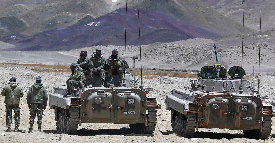 This picture taken on May 19, 2024, shows armoured vehicles of the Indian army at a military camp in Eastern Ladakh. - Lines on a map once meant little to India's Tibetan herders of the high Himalayas, expertly guiding their goats through even the harshest winters to pastures on age-old seasonal routes. That stopped in 2020, after troops from nuclear-armed rivals India and China clashed in bitter hand-to-hand combat in the contested high-altitude border lands of Ladakh. (Photo by TAUSEEF MUSTAFA / AFP)