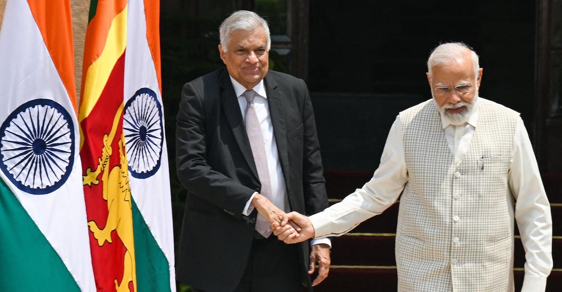 Sri Lanka's President Ranil Wickremesinghe (L) shakes hands with India's Prime Minister Narendra Modi before a meeting at Hyderabad House in New Delhi on July 21, 2023. (Photo by Money SHARMA / AFP)