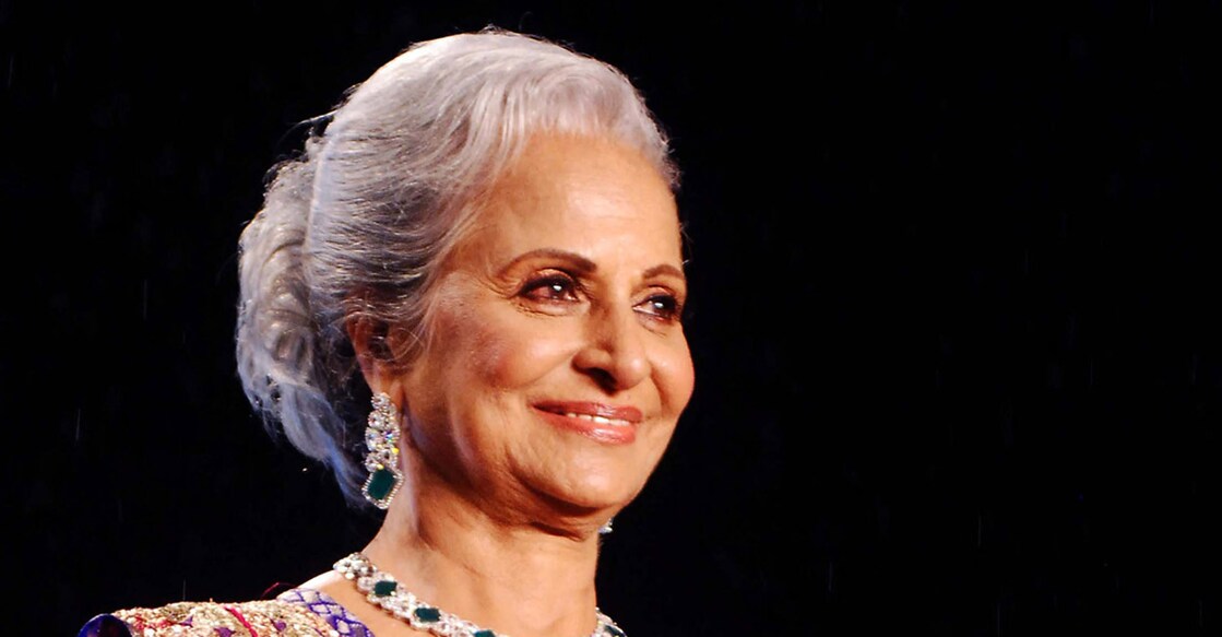 India Bollywood actress Waheeda Rahman walks the ramp displaying a creation by designer Shaina NC during the eighth annual ‘Caring with Style’ fashion show in Mumbai late on June 2, 2013. The show was held in association with The Cancer Patients Aid Association which supports children suffering from blood cancer.  AFP PHOTO/ STR (Photo by STRDEL / AFP)