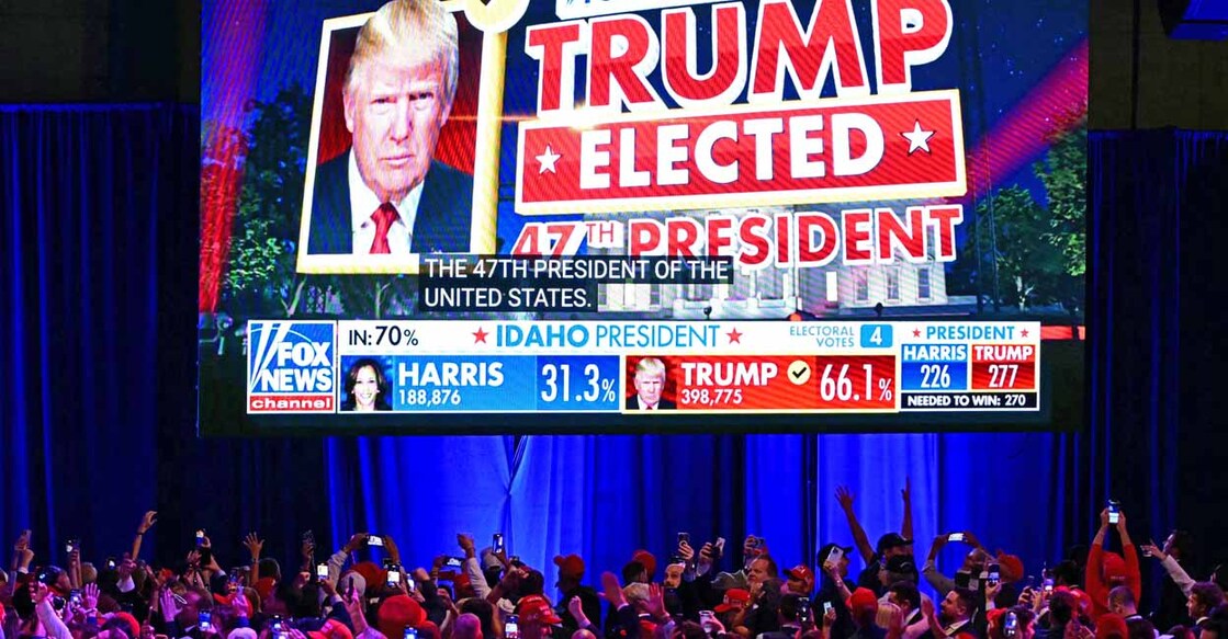 Supporters of former US President and Republican presidential candidate Donald Trump celebrate as Fox News declares him the next President of the United States during an election night event at the West Palm Beach Convention Center in West Palm Beach, Florida, early on November 6, 2024. (Photo by Jim WATSON / AFP)