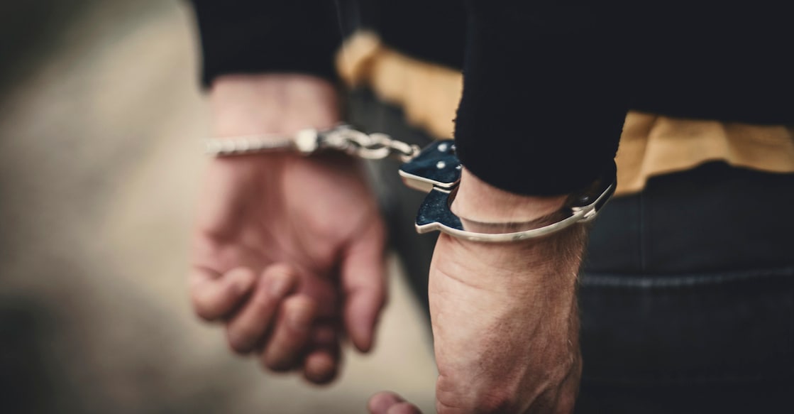 Man in handcuffs behind his back
