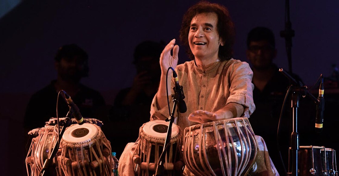 Indian tabala virtuoso Ustad Zakir Hussain performs at a concert at the Indian Music Experience (IME), India’s first interactive music museum, in Bangalore on July 27, 2019. (Photo by Manjunath Kiran / AFP)