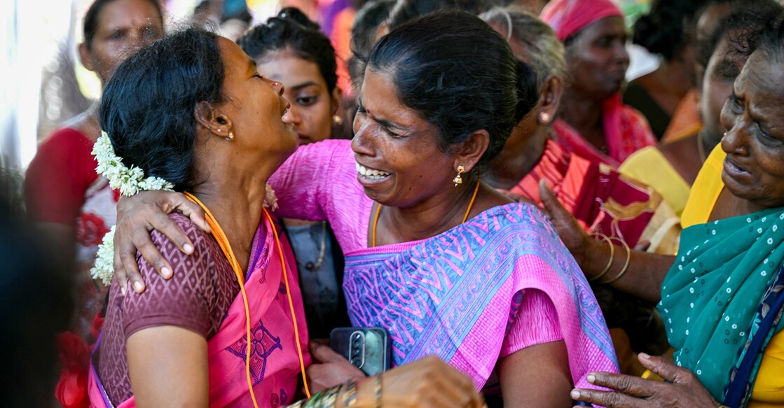 Relatives mourn near the deceased who consumed toxic alcohol in Kallakurichi district of India's Tamil Nadu state on June 24, 2024. - The death toll from a batch of toxic illegal alcohol in India had risen to 56, police said on June 24, with 117 people in hospital recovering from the deadly drink. (Photo by R. Satish BABU / AFP)