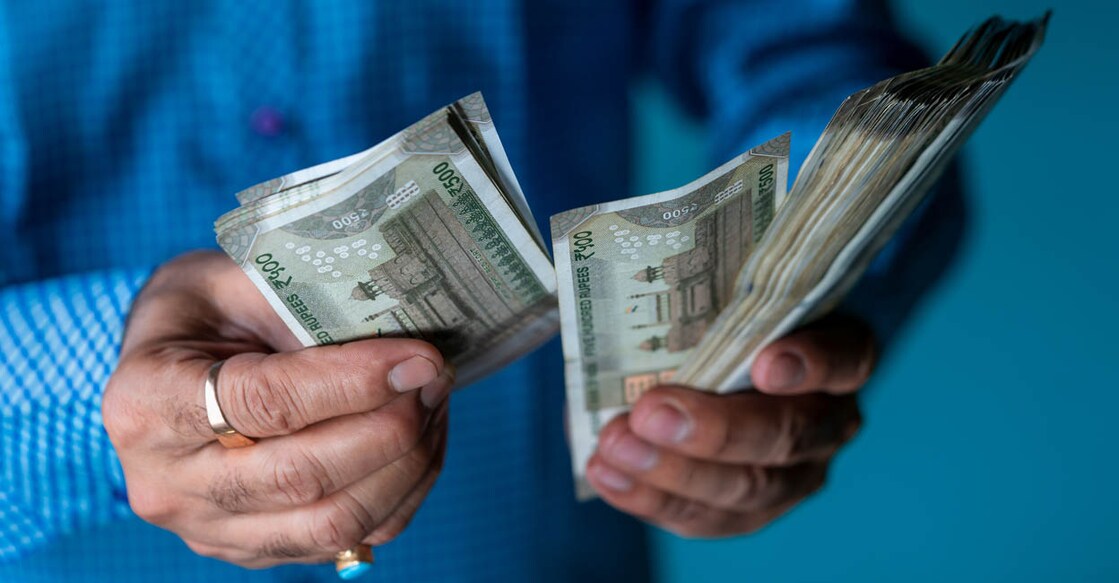 Indian business man counting newly launched indian five hundred rupees. Money counting background concept with copy space.