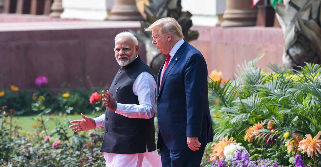 US President Donald Trump (R) and India's Prime Minister Narendra Modi arrive for a joint press conference at Hyderabad House in New Delhi on February 25, 2020. (Photo by Prakash SINGH / AFP)