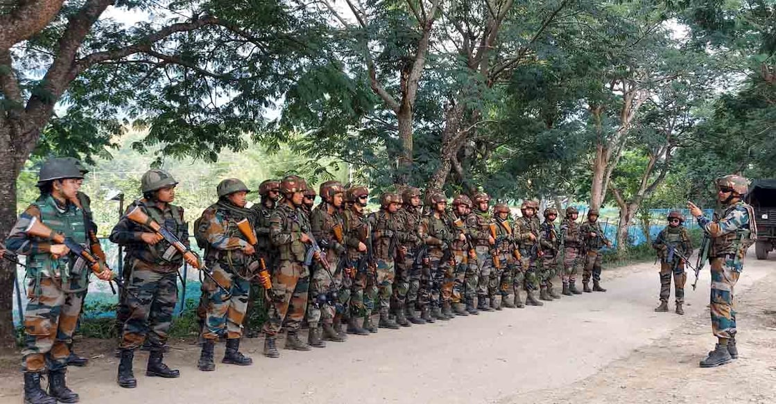 INDIA-UNREST-MANIPUR Indian Army and Assam Rifles personnel take part in a search operation of illegal weapons in Waroching village in Kangpokpi district some 24 km from Imphal on June 3, 2023, following ongoing ethnic violence in India's northeastern Manipur state. (Photo by AFP)