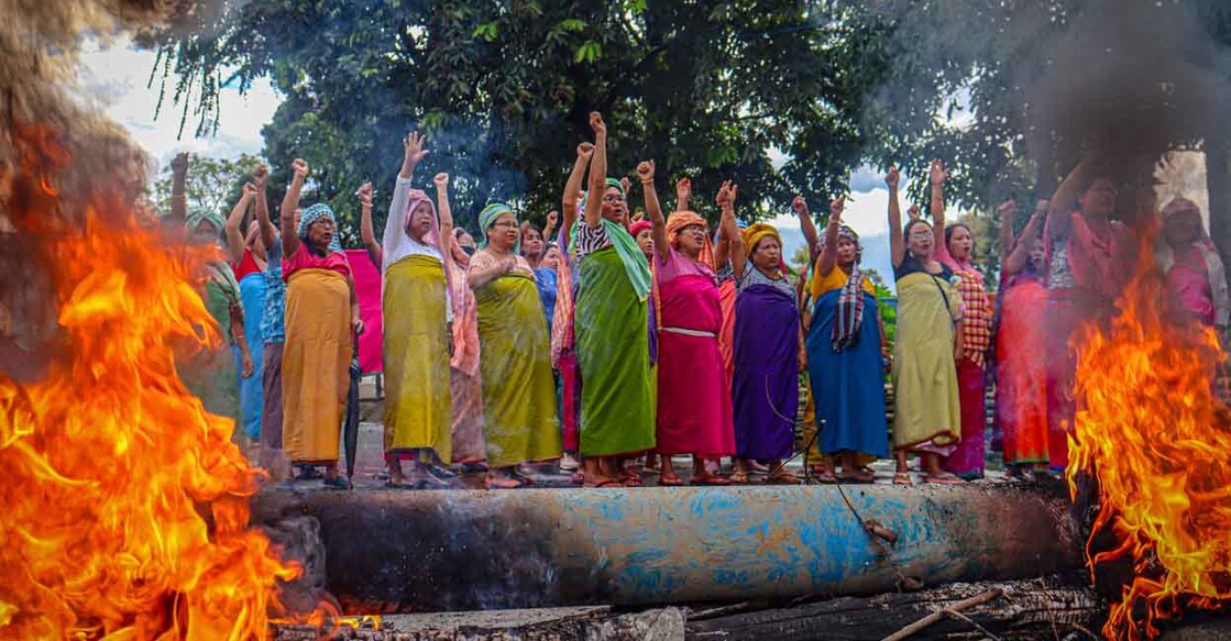 Women protesters shout slogans during 48-hour general strike in Imphal on September 19, 2023, as they demand restoration of peace in India's northeastern state of Manipur after ethnic violence. (Photo by AFP)