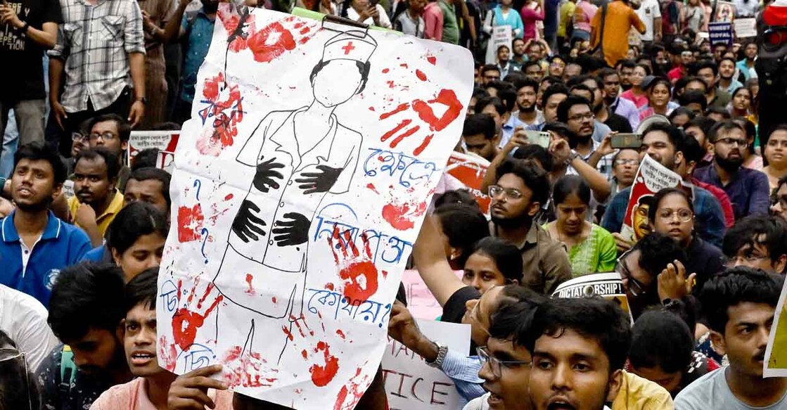 Junior doctors hold posters during a protest to demand the resignation of a city police commissioner and condemn the rape and murder of a medic, in Kolkata on September 2, 2024. - The discovery of the 31-year-old doctor's bloodied body at a state-run hospital in Kolkata on August 9 stoked nationwide anger at the chronic issue of violence against women, that sparked strikes by medics and rallies backed by thousands of ordinary citizens across India. (Photo by Dibyangshu SARKAR / AFP)