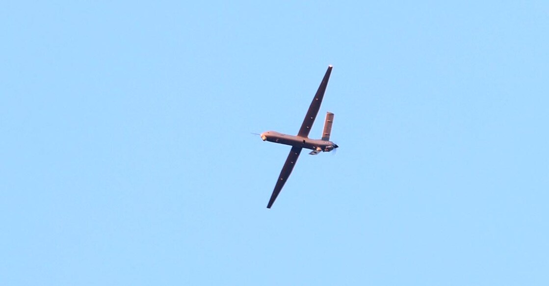 TURKEY-EXPLOSION-ATTACK A Turkish drone flies over the Turkish Aerospace Industries (TAI) building, after a huge explosion at the TAI headquarters, in Kahramankazan, some 40 kilometers (25 miles) north of Ankara on October 23, 2024. - Four people were killed and 14 others wounded in an attack on the headquarters of a top Turkish defence firm TAI, near Ankara, Turkish officials said October 23. (Photo by Adem ALTAN / AFP)