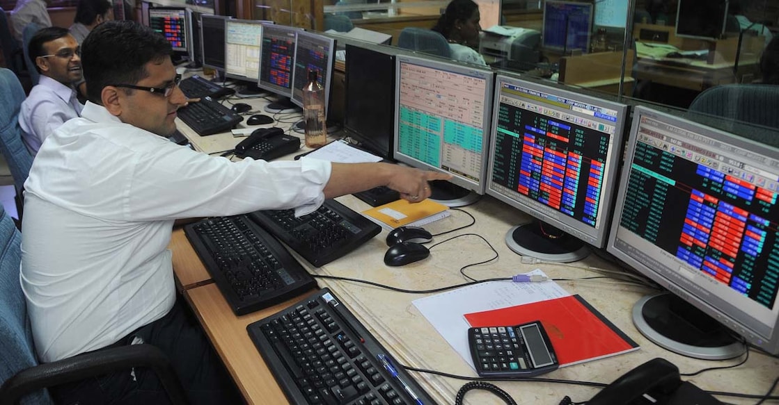 Indian stock traders react on seeing the 30 share benchmark index SENSEX cross 24,000 points during intra-day trade at a brokerage house in Mumbai on May 13, 2014.  India's stock market surged for the third straight day to a record high May 13 as exit polls indicated that Hindu nationalist party leader Narendra Modi was on course to become the country's next prime minister.  AFP PHOTO/ INDRANIL MUKHERJEE (Photo by INDRANIL MUKHERJEE / AFP)