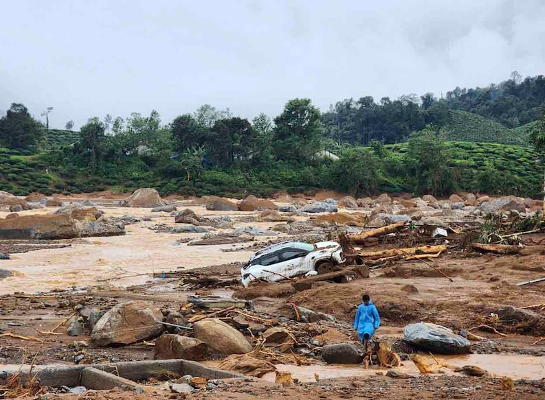 India Landslides A damaged car lies amid debris after landslides hit hilly villages in Wayanad district, Kerala state, India, Tuesday, July 30, 2024. (AP Photo)