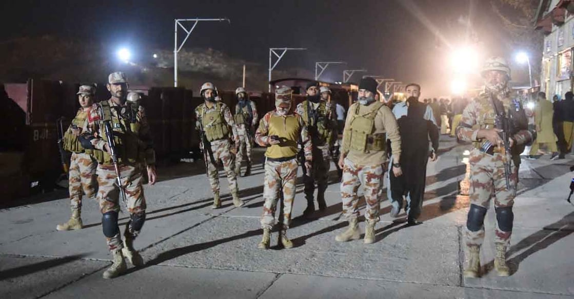 PAKISTAN-UNREST-TRAIN Soldiers secure Mach railway station after Pakistani security forces freed some passengers following a security operation against armed militants who ambushed the train in the remote mountainous area, in Mach, southwestern Balochistan province on March 12, 2025. Three people were killed and around a hundred hostages freed by Pakistani troops on March 11 after armed militants attacked a train carrying over 450 passengers in the country's southwestern Balochistan province. (Photo by Banaras KHAN / AFP)