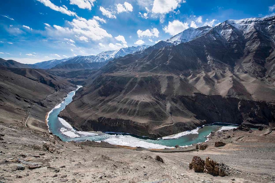 Indus River in Ladakh between Leh and Lamayuru, Nothern India in an altitude of approx. 3550 m. The Indus is a major south-flowing river in South Asia and with 3,180 km (1,980 mi) one of longest rivers in Asia. The Indus is also strategical important because it comes from India and flows into Pakistan where it provides key water resources for Pakistan's economy. The ultimate source of the Indus is in Tibet; the river begins at the confluence of the Sengge Zangbo and Gar Tsangpo rivers that drain the Nganglong Kangri and Gangdise Shan (Gang Rinpoche, Mt. Kailas) mountain ranges. The Indus then flows northwest through Ladakh and Baltistan into Gilgit, just south of the Karakoram range.