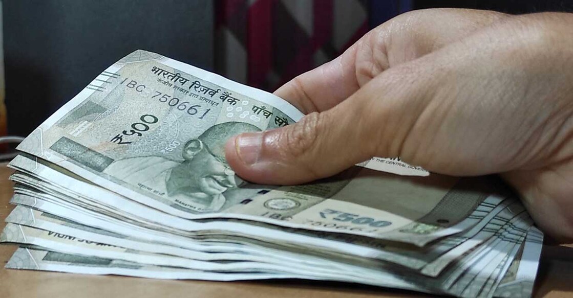 money in hand , Indian currency of 500 rupee note cash in hand, investment, banking,