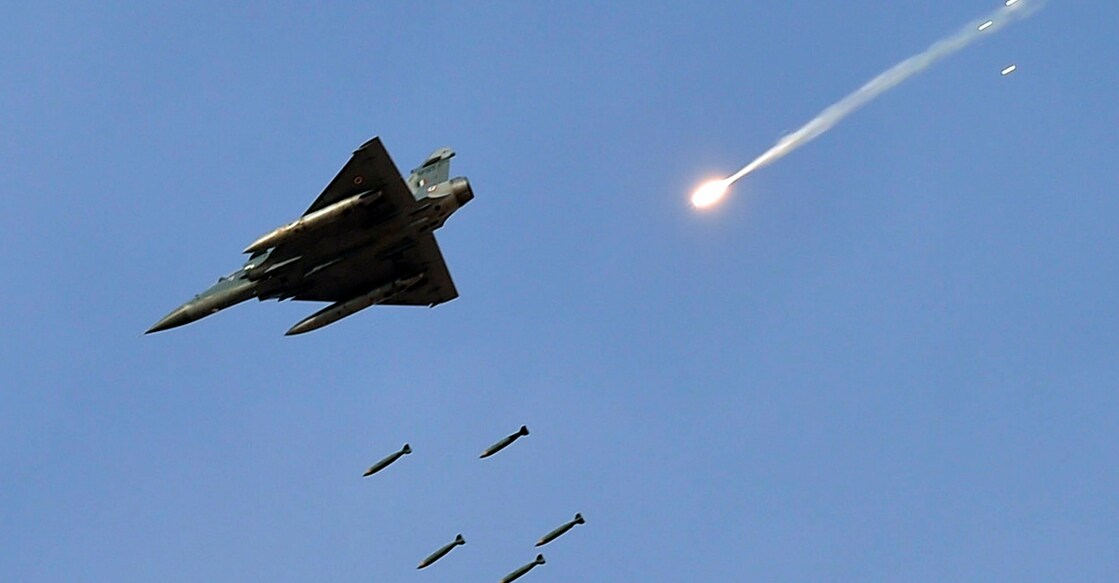 New Delhi: In this Feb 16, 2019 file picture a Mirage 2000 fighter jet releases bombs during the IAF exercise named "Vayu Shakti 2019" at the Air Force field firing range of Pokhran in Rajasthan. As per sources, 12 Mirage 2000 fighter jets of the Indian Air Force struck Jaish-e-Muhammed (JeM) terror camps in an early morning strike, Tuesday, Feb 26, 2019. (PTI Photo/Manvender Vashist) (PTI2_26_2019_000183B)