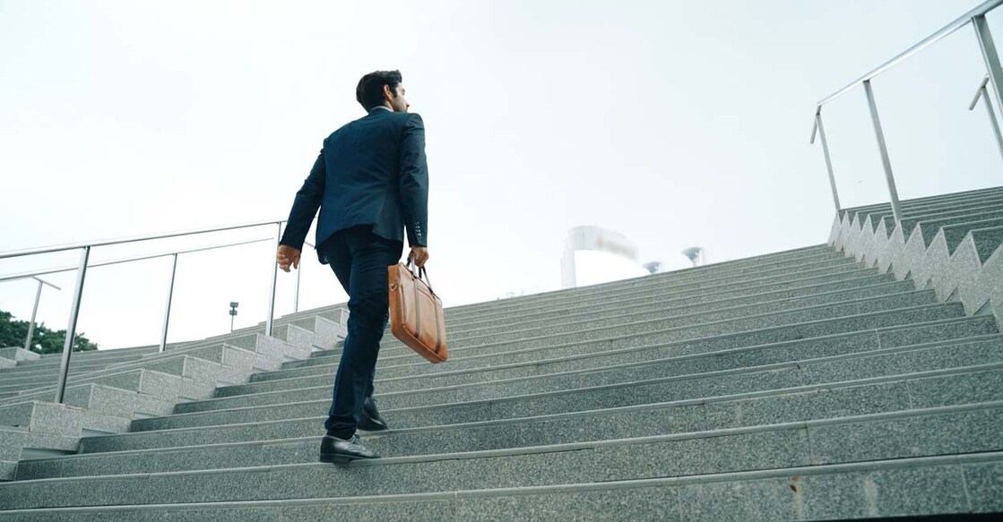 man walking up stairs
