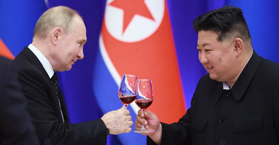 In this pool photograph distributed by the Russian state agency Sputnik, Russian President Vladimir Putin and North Korean leader Kim Jong Un toast during a reception at the Mongnangwan Reception House in Pyongyang on June 19, 2024. - Putin enjoyed a red carpet welcome, a military ceremony and an embrace from North Korea's Kim Jong Un during a state visit to Pyongyang where they both pledged to forge closer ties. (Photo by Vladimir Smirnov / POOL / AFP) / -- EDITOR'S NOTE : THIS IMAGE IS DISTRIBUTED BY THE RUSSIAN STATE OWNED AGENCY SPUTNIK --