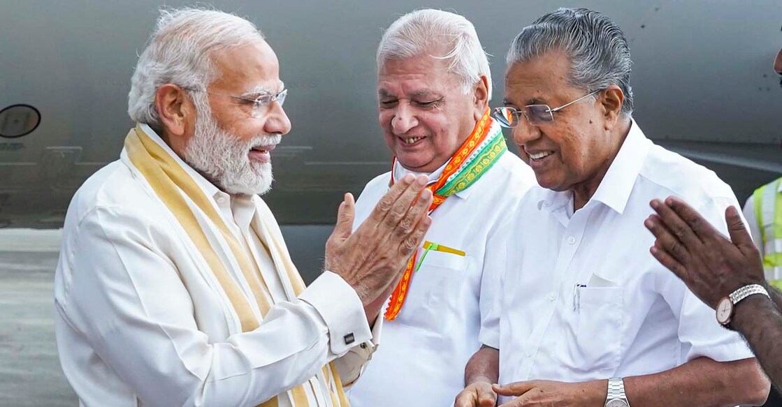 PTI09_01_2022_000133A Kochi: Kerala Governor Arif Mohammad Khan and Chief Minister Pinarayi Vijayan receive Prime Minister Narendra Modi on his arrival at the Kochi International Airport, Thursday, Sep 1, 2022. (PTI Photo) (PTI09_01_2022_000133A)