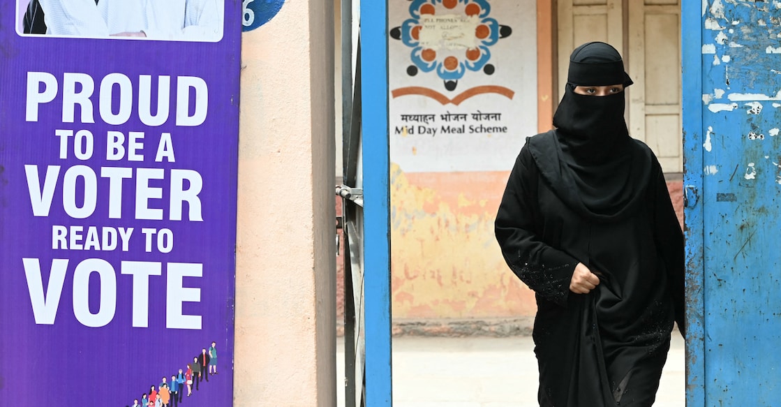 A Muslim woman leaves after casting her ballot at a polling station during the fourth phase of voting in India’s general election, in Hyderabad on May 13, 2024. (Photo by NOAH SEELAM / AFP)