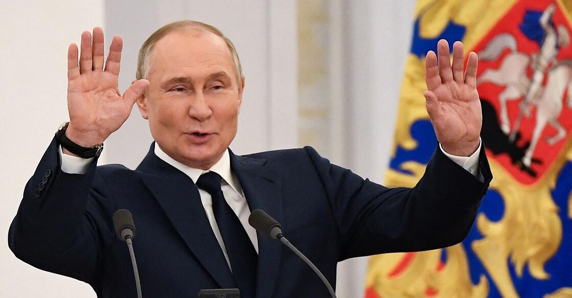 Russian President Vladimir Putin reacts as he hosts Russia's medal-winning athletes of the Beijing 2022 Winter Olympic Games and members of the country's Paralympic team at the Kremlin in Moscow on April 26, 2022. (Photo by NATALIA KOLESNIKOVA / AFP)