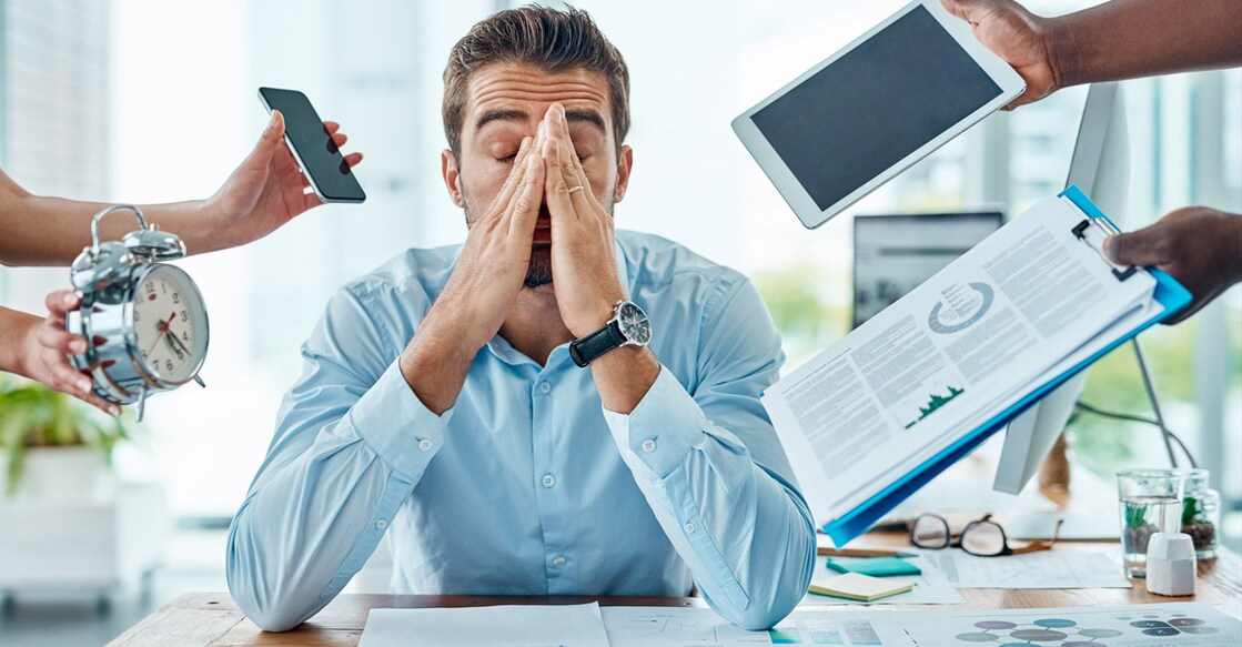 Portrait of a young businessman looking stressed out in a demanding office environment