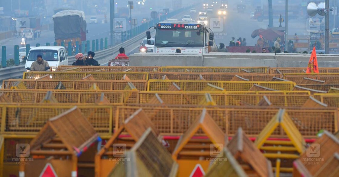 farmers-protest-one NEW DELHI 2024 FEBRUARY 13 : At Sonipat Kundli on the Haryana border police setup the concrete barricades and sand filled containers to block the farmers' strike reaching Delhi. @ JOSEKUTTY PANACKAL