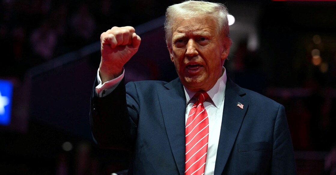 US President-elect Donald Trump reacts during a MAGA victory rally at Capital One Arena in Washington, DC, on January 19, 2025, one day ahead of his inauguration ceremony. (Photo by Jim WATSON / AFP)