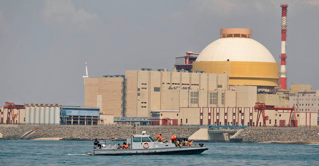 India Bomb Blast FILE - In this Monday, Oct. 8, 2012 file photo, Indian coast guards ride on a boat near the Russian-built Kudankulam Atomic Power Project, background, during a protest at Kudankulam, about 700 kilometers (440 miles) south of Chennai, Tamil Nadu state, India. A crude bomb exploded near the nuclear plant in southern India, demolishing two houses and killing six people, police said Wednesday, Nov. 27, 2013. One of three people seriously injured was identified by police as an anti-nuclear activist and a suspect in the case. (AP Photo/Arun Sankar K., File)