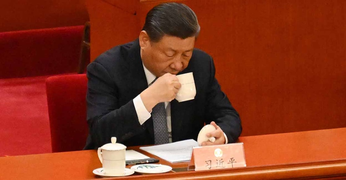 China's President Xi Jinping drinks tea as he attends the opening ceremony of the Chinese People's Political Consultative Conference (CPPCC) at the Great Hall of the People in Beijing on March 4, 2024. (Photo by JADE GAO / AFP)