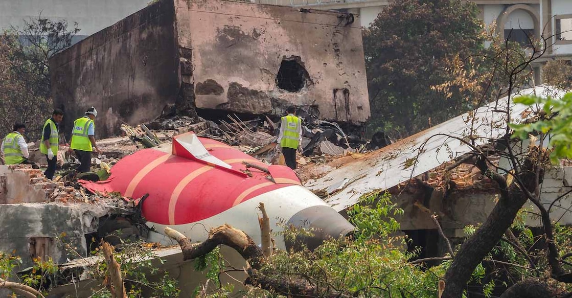 INDIA-AVIATION-CRASH An investigation team inspects the wreckage of Air India flight 171 a day after it crashed in a residential area near the airport, in Ahmedabad on June 13, 2025. Investigators recovered a black box recorder from the crash site on June 13 of a London-bound passenger jet that ploughed into a residential area of India's Ahmedabad city, killing at least 265 people on board and on the ground. (Photo by Sam PANTHAKY / AFP)