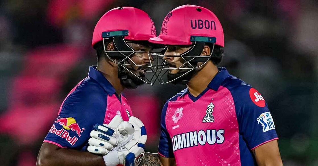 Rajasthan Royals' Riyan Parag (R) is congratulated by captain Sanju Samson after scoring a half-century (50 runs) during the Indian Premier League (IPL) Twenty20 cricket match between Rajasthan Royals and Gujarat Titans at the Sawai Mansingh Stadium in Jaipur on April 10, 2024. (Photo by Arun SANKAR / AFP) / -- IMAGE RESTRICTED TO EDITORIAL USE - STRICTLY NO COMMERCIAL USE -- - -- IMAGE RESTRICTED TO EDITORIAL USE - STRICTLY NO COMMERCIAL USE --
