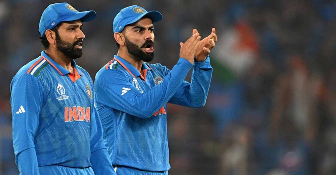 India's captain Rohit Sharma (L) and teammate Virat Kohli celebrate after the dismissal of Australia's Mitchell Marsh during the 2023 ICC Men's Cricket World Cup one-day international (ODI) final match between India and Australia at the Narendra Modi Stadium in Ahmedabad on November 19, 2023. (Photo by Punit PARANJPE / AFP) / -- IMAGE RESTRICTED TO EDITORIAL USE - STRICTLY NO COMMERCIAL USE -- - -- IMAGE RESTRICTED TO EDITORIAL USE - STRICTLY NO COMMERCIAL USE --