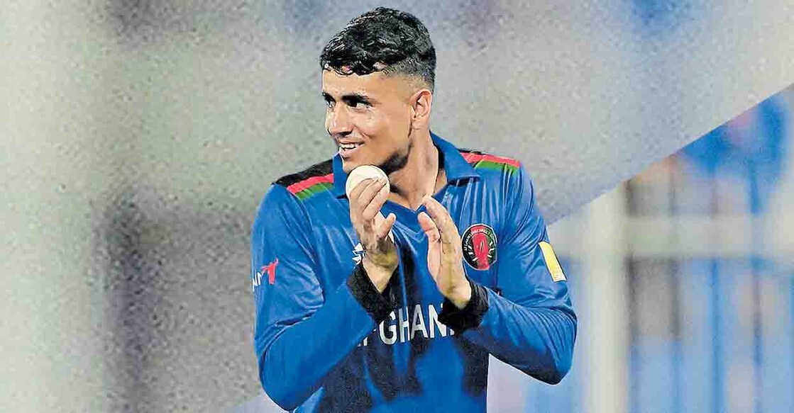 SHARJAH, UNITED ARAB EMIRATES - OCTOBER 25: Mujeeb Ur Rahman of Afghanistan leaves the field after taking five wickets following the ICC Men's T20 World Cup match between Afghanistan and Scotland at Sharjah Cricket Stadium on October 25, 2021 in Sharjah, United Arab Emirates. (Photo by Alex Davidson/Getty Images)