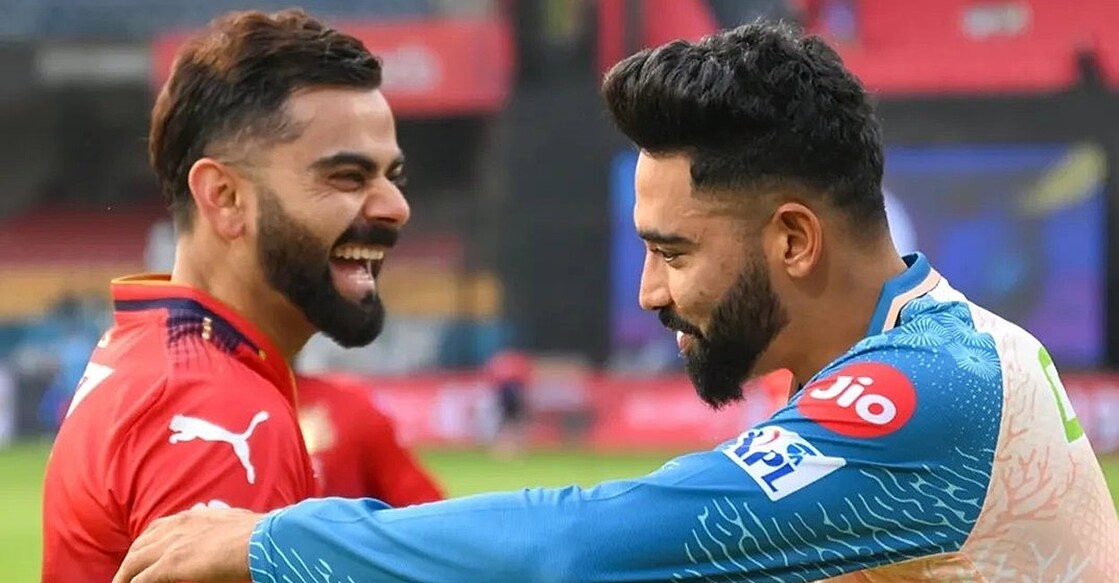 ഐപിഎൽ പരിശീലനത്തിനിടെ വിരാട് കോലിയും മുഹമ്മദ് സിറാജും കണ്ടുമുട്ടിയപ്പോൾ (ആർസിബി പങ്കുവച്ച ചിത്രം)