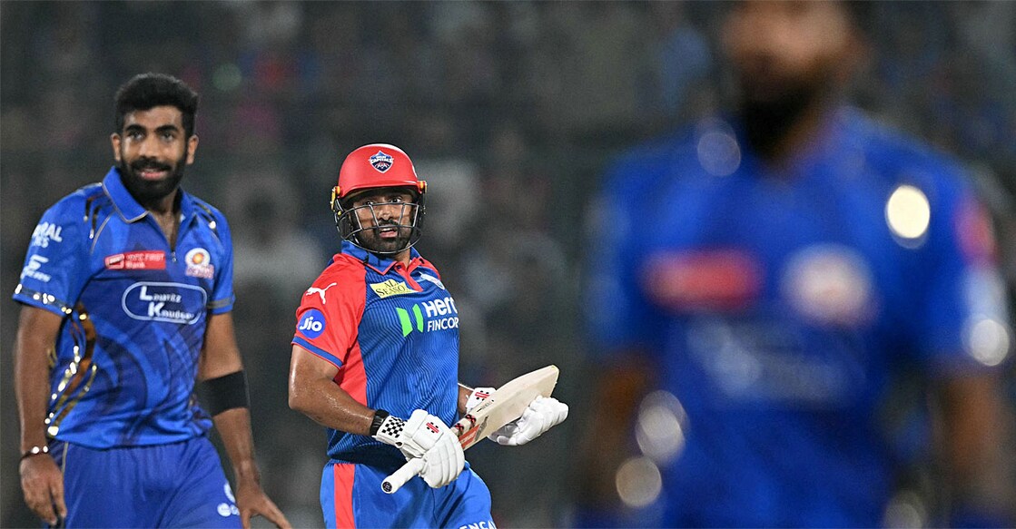 ജസ്പ്രീത് ബുമ്രയും കരുൺ നായരും മത്സരത്തിനിടെ (Photo by Sajjad HUSSAIN / AFP) 