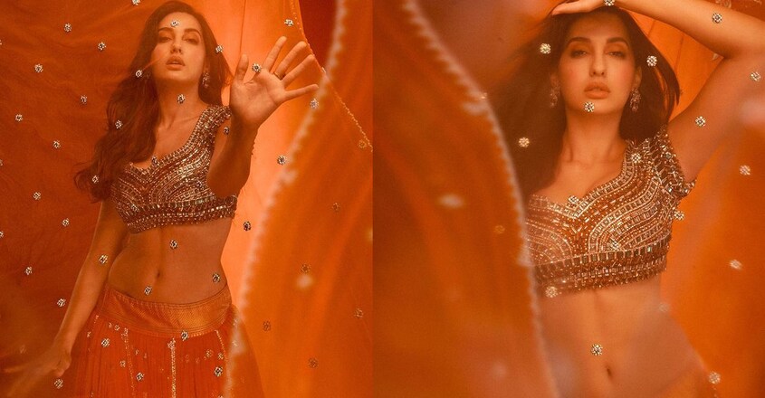 actress-nora-fathehi-looks-hot-in-a-orange-lehenga