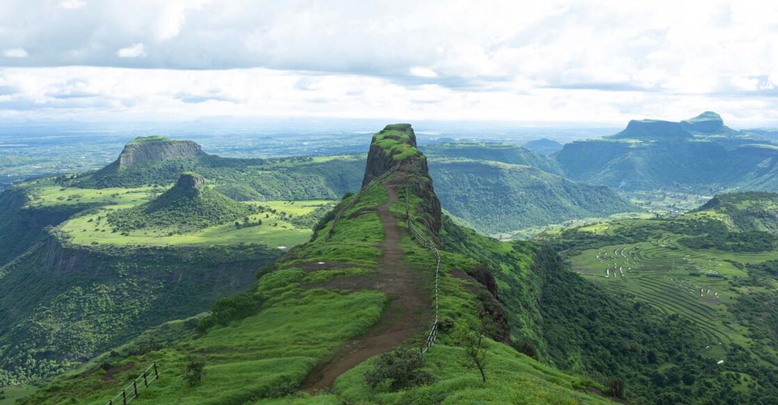 Selfie point with beautiful backdrop of Sahyadri mountains at Dhodap fort, Nashik, Maharashtra. Image Credit: ePhotocorp/istockphoto