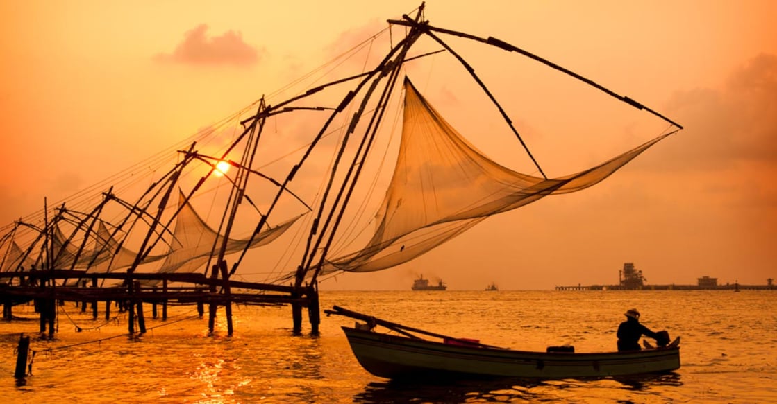 Sunset over Chinese Fishing nets and boat in Cochin, Kerala. Image Credit :johnnychaos/istockphotos