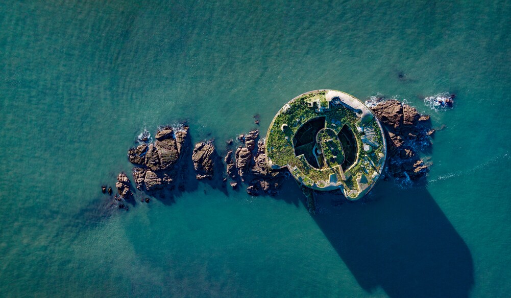 Aerial photo from a drone of Stack Rock Fort, a small fort built on an island in the Milford Haven Waterway, Pembrokeshire, Wales, UK. Image Credit: Aerial Essex/istockphoto