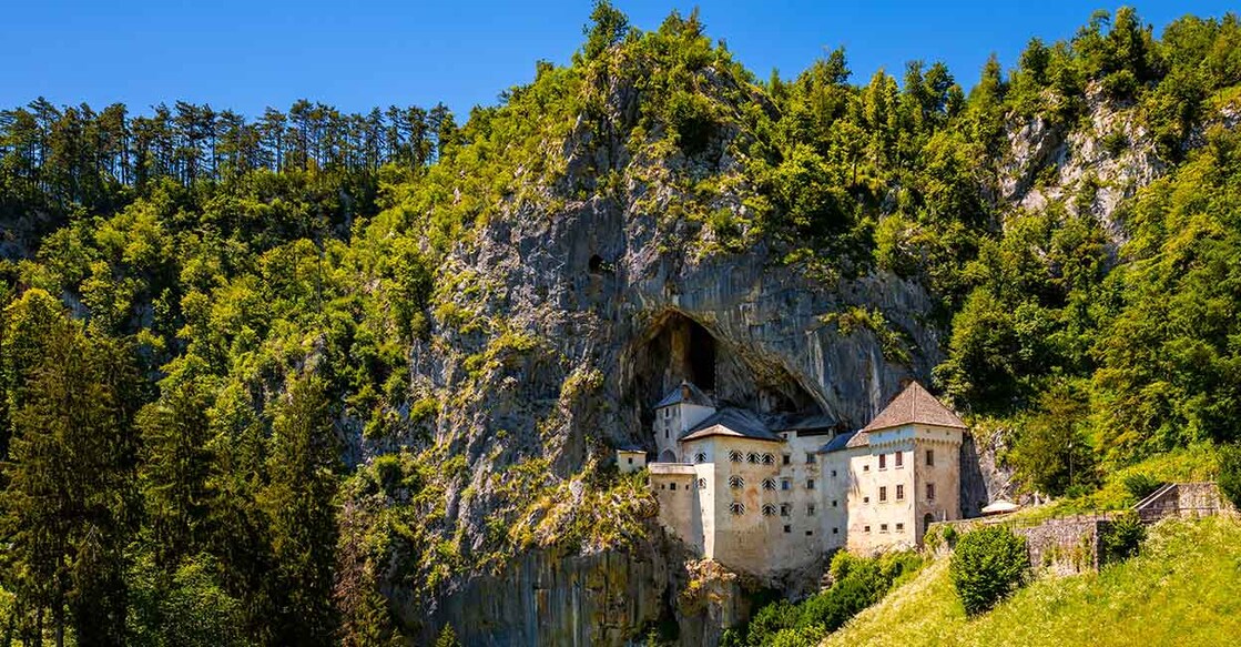 Predjama castle built in a cave in Slovenia. Image Credit: ON-Photography Germany/shutterstock