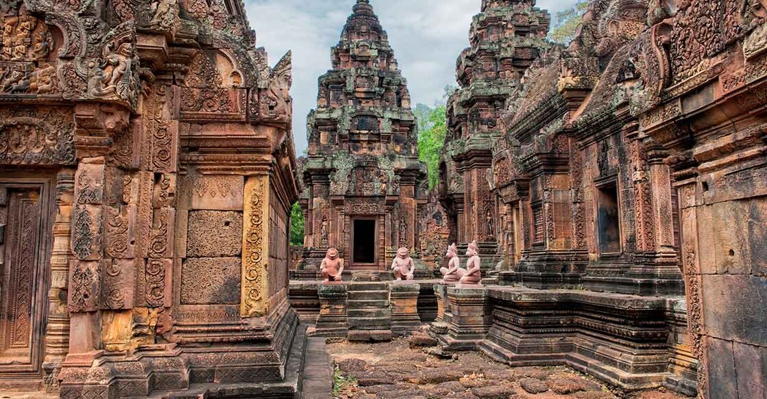 Banteay Srei - a 10th century Hindu temple dedicated to Shiva. The temple built in red sandstone was forgotten for centuries and rediscovered 1814 in the jungle of the Angkor area of Cambodia. Image Credit: Rolf_52/istockphoto